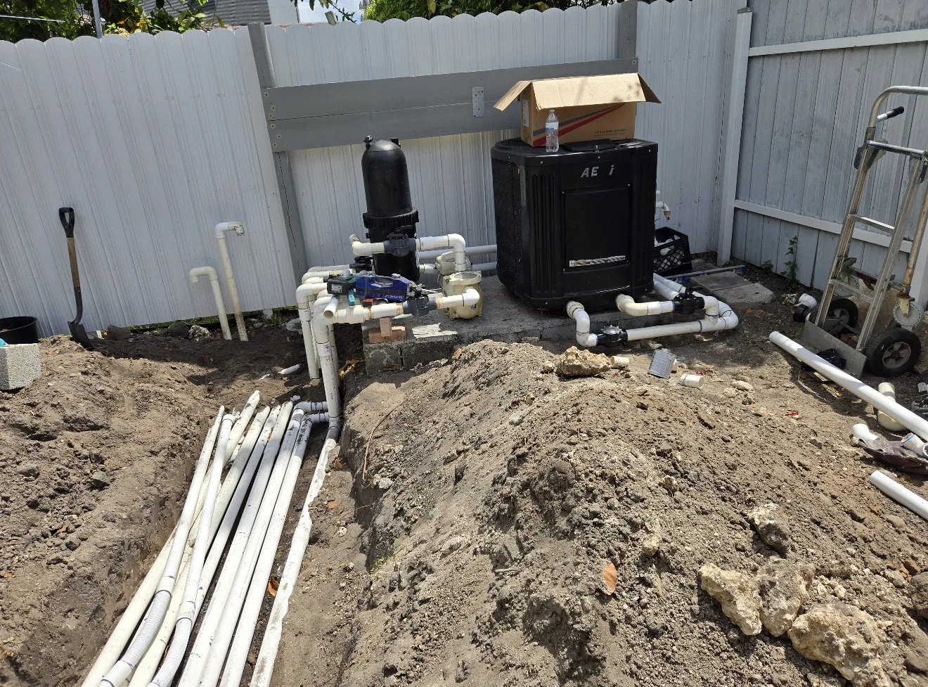 Overview of pool equipment and excavated area