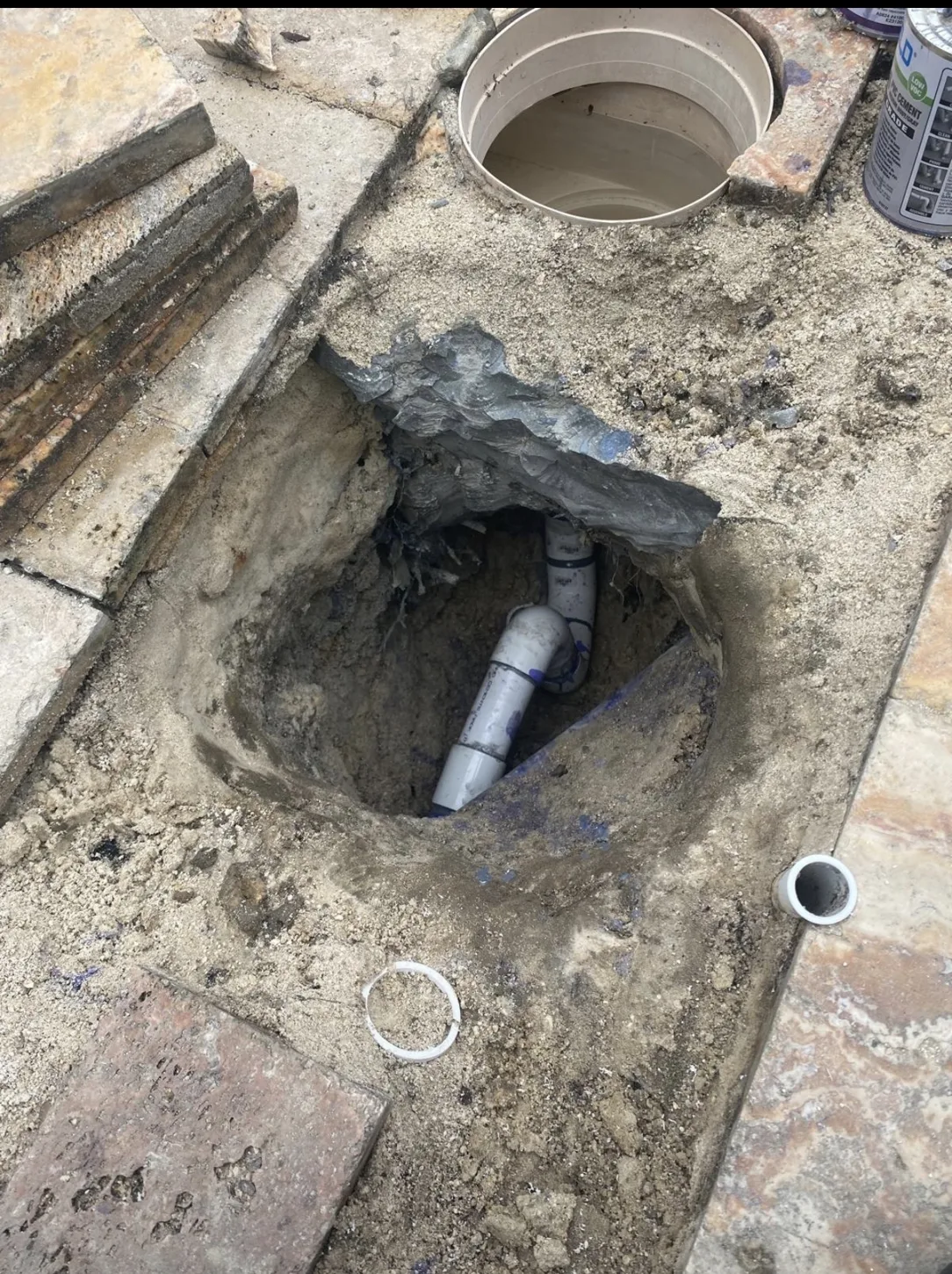 Excavation around pool plumbing connection